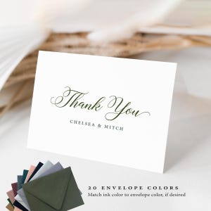 May include: A white folded card with the words "Thank You" in elegant green script, with "CHELSEA & MITCH" below. A selection of colored envelopes is displayed below the card. The text "20 ENVELOPE COLORS" is visible, along with additional text.