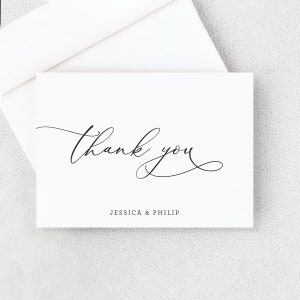 May include: White thank you card with black calligraphy that says "thank you" and the names "Jessica & Philip" printed below.