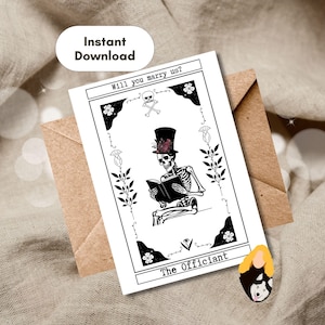 May include: A white rectangular card featuring a black and white illustration of a skeleton wearing a top hat with flowers, reading a book. The text reads Will you marry us? at the top and The Officiant at the bottom, framed by floral borders.