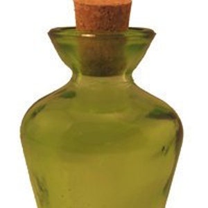 May include: A small, green glass bottle with a cork stopper. The bottle has a rounded body and a flared neck.