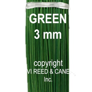 May include: A bundle of green floral wire, 3 mm thick, for floral arrangements.  The wire is tied together with white string.  The text "GREEN 3 mm" and "copyright VI REED & CANE Inc." is printed on the bundle.