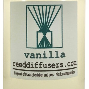 May include: A clear glass bottle with a white cap filled with a light yellow liquid. The label reads "vanilla reeddiffusers.com" and "Keep out of reach of children and pets - Not for consumption."