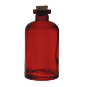 May include: A red glass bottle with a cork stopper. The bottle is clear and has a textured surface.
