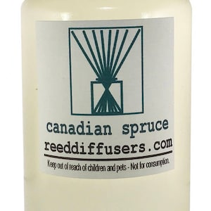 May include: A clear glass bottle with a white cap filled with a light yellow liquid. The label reads "canadian spruce reeddiffusers.com" and "Keep out of reach of children and pets - Not for consumption."