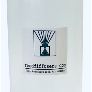 May include: A clear plastic bottle with a white cap. The bottle has a label with the text "reeddiffusers.com" and the words "Keep out of reach of children and pets - Not for consumption."