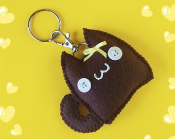 Porte-clés en peluche mignon Kawaii jaune arc marron chat porte-clés et breloque de sac, accessoires de chat en peluche Kawaii mignon, 3 pouces de hauteur x 3 1/2 pouces de large