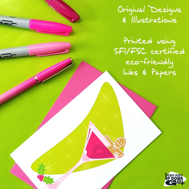 May include: A green and white holiday greeting card with a martini glass filled with pink liquid and a gingerbread man inside. The card has a green background with white stars and the text "Pushy Pushy Up Down Go!" at the bottom.
