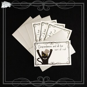 May include: A set of five blank greeting cards with a black cat wearing a top hat and the text "Congratulations and all that sort of rot!" printed on the front.