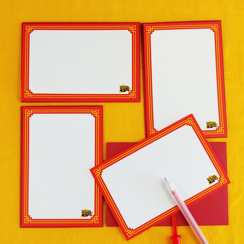May include: A collection of stationery with red and gold decorative borders. The set includes rectangular and square notepads, a red envelope, and a pen. The stationery has a logo in the corner that reads "Love Up Down Gifts".
