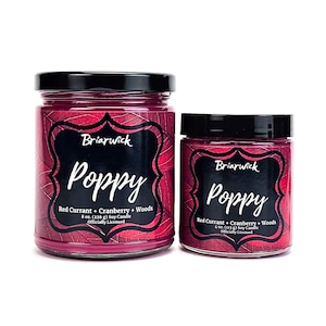 May include: Two glass candle jars with black lids. The larger jar is 8 ounces and the smaller jar is 4 ounces. Both jars have a red currant, cranberry, and woods scented soy candle. The label on the jars says "Briarwick Poppy" and "Officially Licensed".