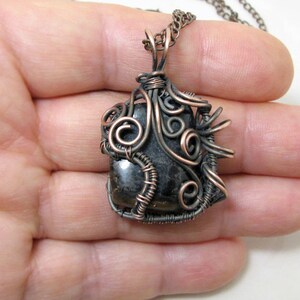 Copper Pendant with raw Garnet. Jewelry as a talisman. Protective amulet. Forged copper wire pendant. Necklace with natural stone for yoga.