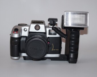 Vintage Automatic Camera - sees the batteries and reacts to the movement of the lens and the light bulb Camera has not been tested