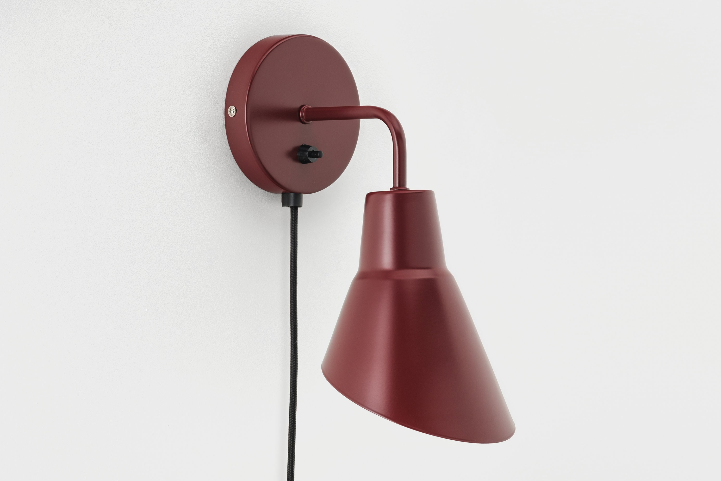 Red plug 2024 in wall sconce