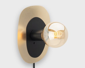 Thea Plug-in Wall Sconce Black On/Off Switch Mid Century Modern Bedside Lamp Raw Brass