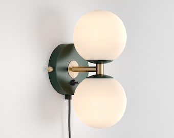 Mid-Century Modern Milk Glass Globe Wall Sconce: Dark Green, Brass Accents, Plug-in Vanity Light