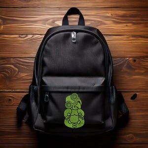 May include: Black backpack with a green tiki design on the front pocket.