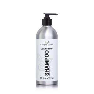 May include: A silver bottle of clarifying shampoo with a black pump top. The bottle is labeled "a simple planet" and "Clarifying Shampoo Unscented". The bottle contains 16 fl oz (473 ml).