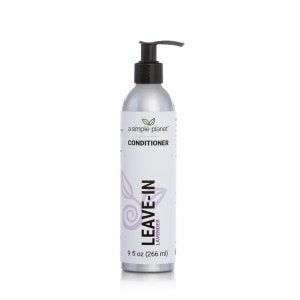 a bottle of leave - in conditioner on a white background