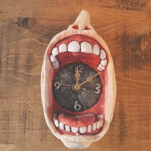 massive gaping gob wall hanging clock