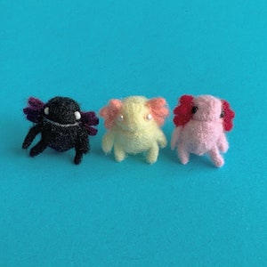 MADE TO ORDER! Handmade needle felted miniature pink / yellow / black axolotl – art doll – phone charm – dust plug – bookmark – pendant