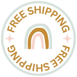 May include: A light blue circle with the text "FREE SHIPPING" in a gold color around the edge. A rainbow with a light blue, pink, and gold color scheme is in the center of the circle.