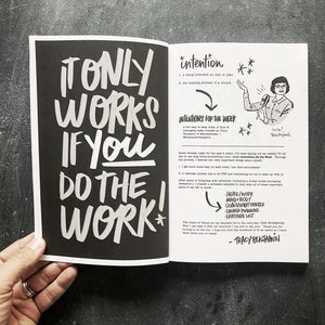 May include: A black and white image of an open book with the text "It only works if you do the work!" on the left page. The right page has the text "intention" and "Intentions for the week" with a list of bullet points. The text "Tracy Benjamin" is at the bottom of the page.