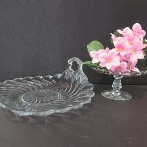 Two Pieces of Fostoria Colony Swirl Glass Cheese Stand and Muffin Tray with Curved Handles, Pedestal Dish and Serving Tray