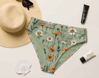 Può includere: Slip bikini verde a vita alta con stampa floreale con fiori bianchi e arancioni.