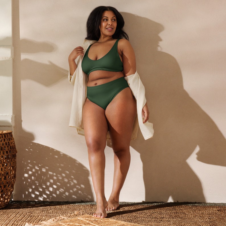 Recycled high-waisted bikini in myrtle green color with green lining.