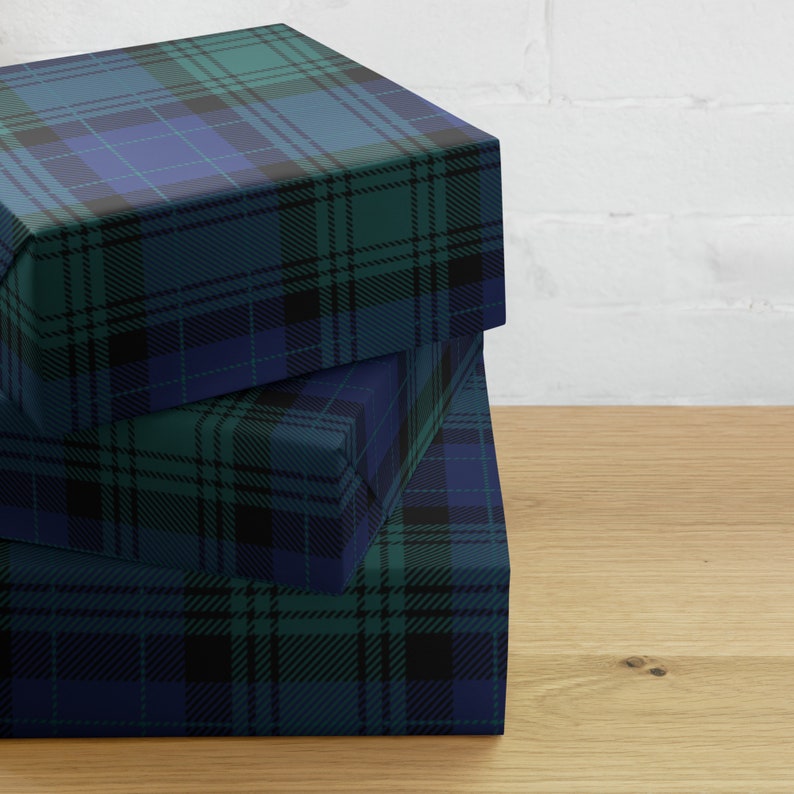 Wrapping paper sheets in black watch pattern.