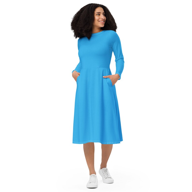 Sky blue long sleeve midi dress has pockets. Sizes up to 6XL.