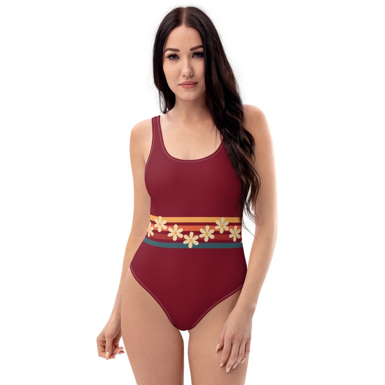Burgundy 70s inspired swimsuit with daisies.