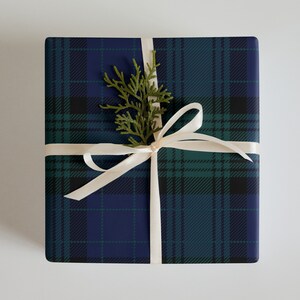 Wrapping paper sheets in black watch pattern.