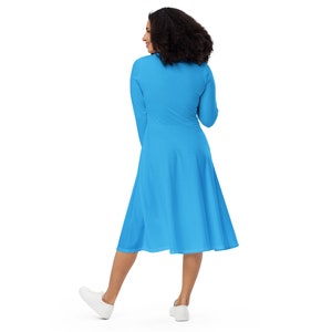 Sky blue long sleeve midi dress has pockets. Sizes up to 6XL.