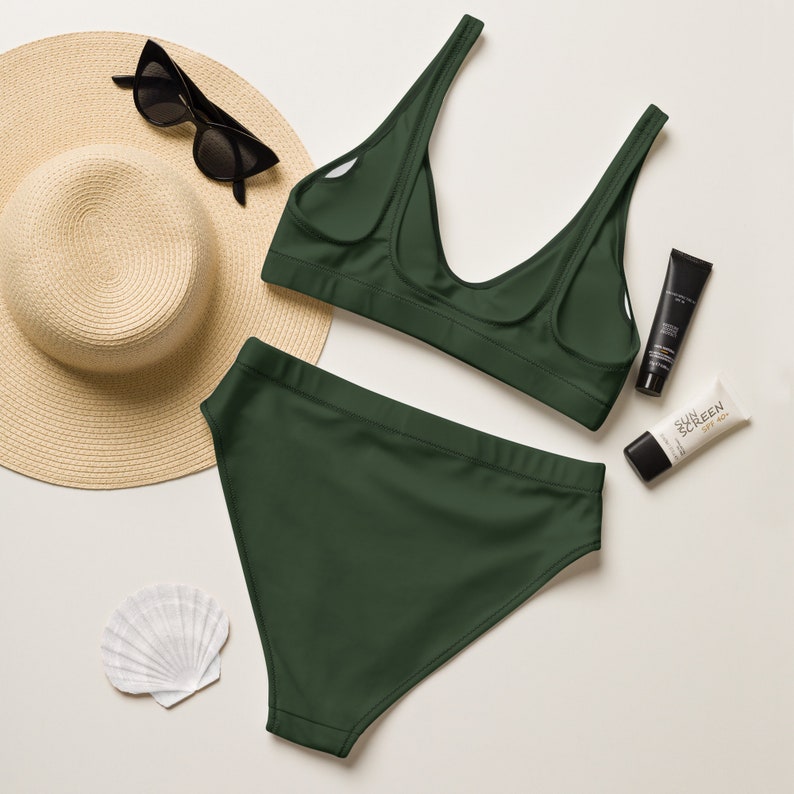 Recycled high-waisted bikini in myrtle green color with green lining.