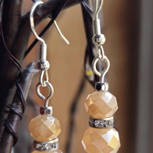 Golden bead dangle earrings, faceted bead earrings, sparkling crystal accent earrings, gold-tone dangle earrings