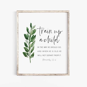 May include: A rectangular wall art print in a weathered wood frame featuring a watercolor illustration of a green leafy branch on the left side and black text that reads: Train up a child IN THE WAY HE SHOULD GO, AND WHEN HE IS OLD HE WILL NOT DEPART FROM IT. Proverbs 22:6.