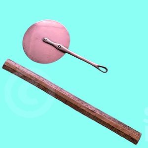 May include: A silver pizza cutter with a round blade and a long handle. A wooden ruler is also in the image.