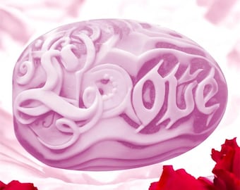 May include: A heart-shaped, pink soap bar with the word "Love" embossed in a decorative script.