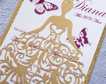 May include: A gold and white invitation with a gold cutout of a woman in a dress and butterflies. The text on the invitation reads "Diana Mis XV Años".