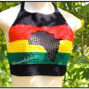 May include: A black, red, yellow, and green crochet halter top with an outline of the continent of Africa in the center. The top has a crocheted design and the text "@mycraftylittlesite" is visible in the bottom right corner.