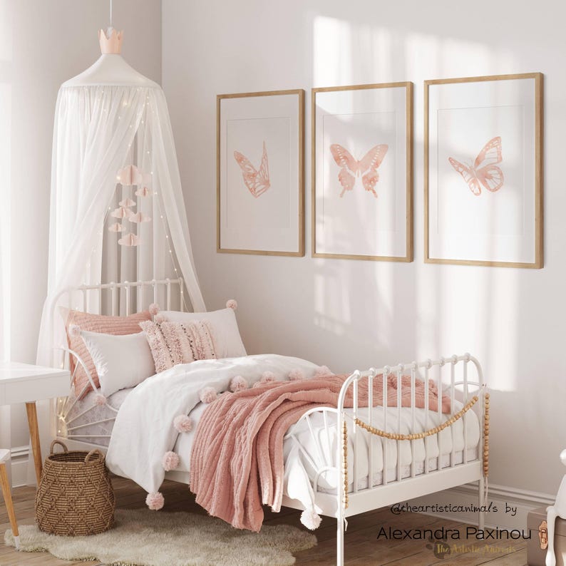 printable butterfly prints set of 3 whole blush pink butterflies. The picture shows how the triptych looks once framed in a girl room over the bed. displayed size 12x18  inch