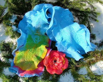 Scarf with two rows of ruffles and a flower brooch.