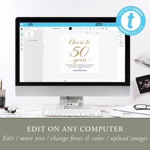 May include: A computer monitor displays a wedding anniversary invitation template. The invitation reads "Cheers to 50 years" in gold script. The screen also shows editing options. The image includes a keyboard, mouse, and other office supplies.