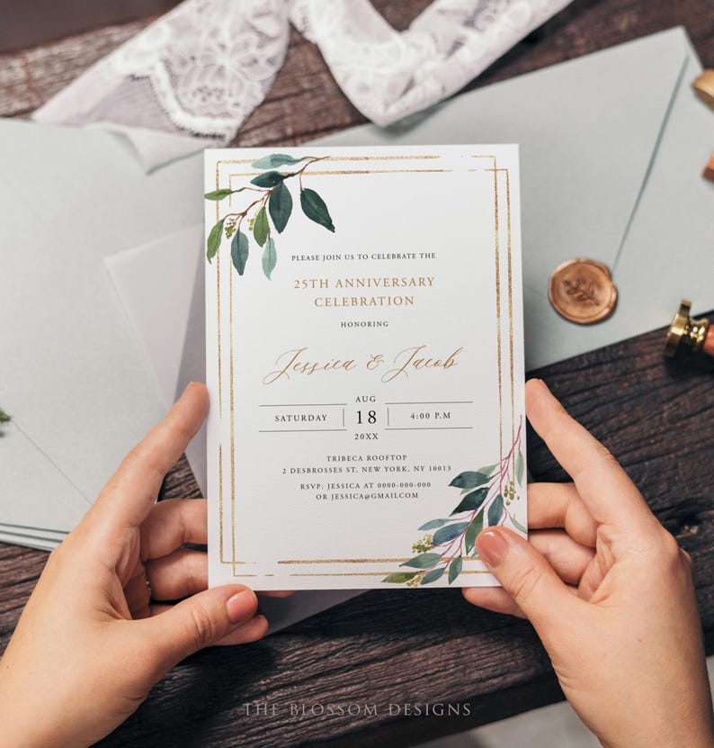 May include: A white invitation card with gold accents and botanical illustrations, held by hands. The card announces a 25th anniversary celebration, with the names Jessica & Jacob, date, time, and location. The Blossom Designs logo is at the bottom.