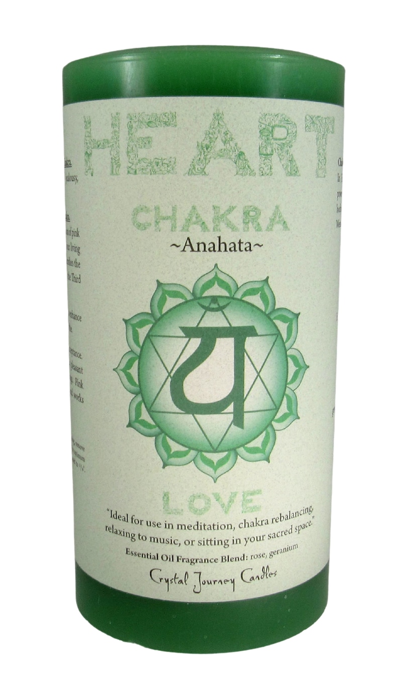 May include: Green candle with a label that says "Heart Chakra ~Anahata~" and a green symbol with the word "LOVE" below it. The label also says "Ideal for use in meditation, chakra rebalancing, relaxing to music, or sitting in your sacred space. Essential Oil Fragrance Blend: rose, geranium Crystal Journey Candles"