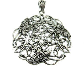 May include: Silver pendant featuring a Celtic knot design with three stylized birds. The pendant is intricately detailed and has a circular shape.