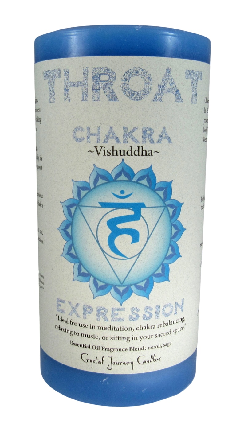 May include: Blue candle with a white label that says "Throat Chakra ~Vishuddha~" and features a blue and white symbol. The label also says "Expression" and "Ideal for use in meditation, chakra rebalancing, relaxing to music, or sitting in your sacred space. Essential Oil Fragrance Blend: neroli, sage Crystal Journey Candles".