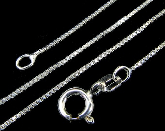 May include: A silver chain necklace with a box chain design. The chain is shown in three lengths, with a lobster clasp closure.