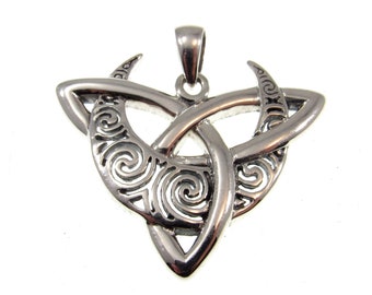 May include: Silver pendant featuring a Celtic knot design with two crescent moons. The pendant is intricately detailed with swirling patterns.